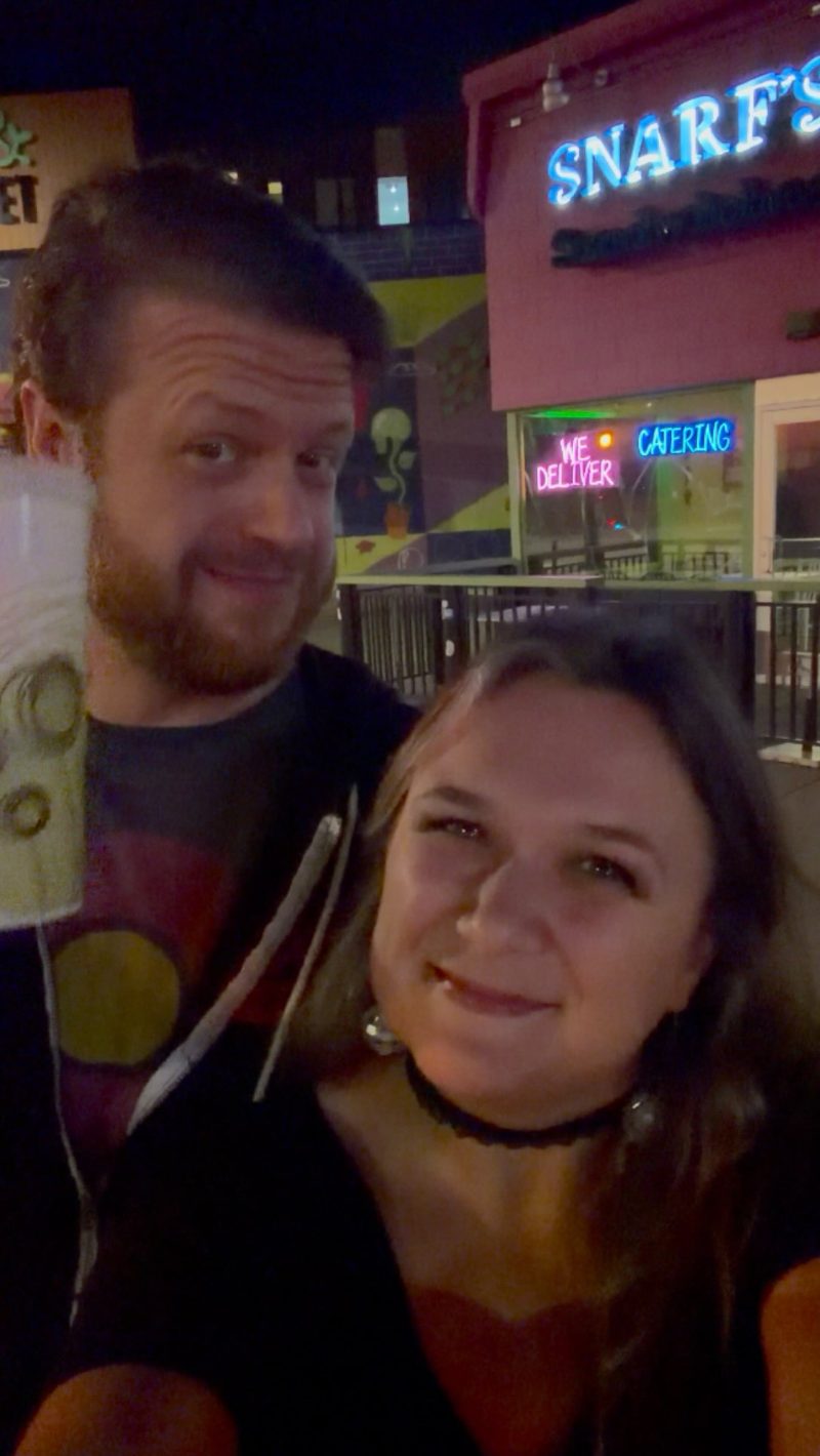 Crystal Rose Reynolds and Ryan T Reynolds outside Snarf's Sandwiches in Denver's Ballpark neighborhood at night